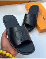 Louis Vuitton Black Flat Mules with Embossed LV Logo